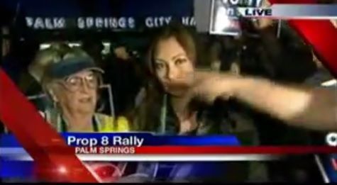 Grandmother (woman in yellow pictured here) starts getting heckled by anti Prop 8 mob.