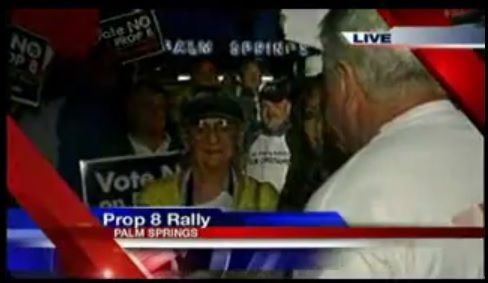 The man in white is screaming at the elderly woman.