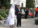 Lesbian groom joined by other homosexual protesters chant and attempt to stop Public Advocate spokesman and lady from handing out wedding cake on Capitol Hill.