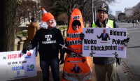 At the Justice Department DOJ protesting the Biden's Mandates and promoting the Defeat the Mandate March by handing out "Wuhan Woke Poke" pens to prolife marchers.