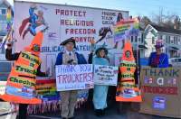 In Hagerstown, MD March 4, 2022, (3/4/2022)  Volunteer dressed in costume of a Giant Orange Cone, that says  "Thank a Trucker Checkpoint" and George Washington welcome the Truckers to stand with them to Protect Religious Freedom. 
American Patriots are uniting for the END GAME, that is, ending the Tyrannical Covid games that are taking away our Constitutional Freedoms!   We want to defend traditional Christian society and protect our values especially Religious Freedom, by organizing ourselves into a peaceful resistance to tyrants who want to destroy our values and the U.S. Constitution.  Public Advocate is standing with the Freedom Convoy Truckers to protect our Religious Freedom.  
