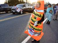 In Hagerstown, MD March 4, 2022, (3/4/2022)  Volunteer dressed in costume of a Giant Orange Cone, that says  "Thank a Trucker Checkpoint" and George Washington welcome the Truckers to stand with them to Protect Religious Freedom.